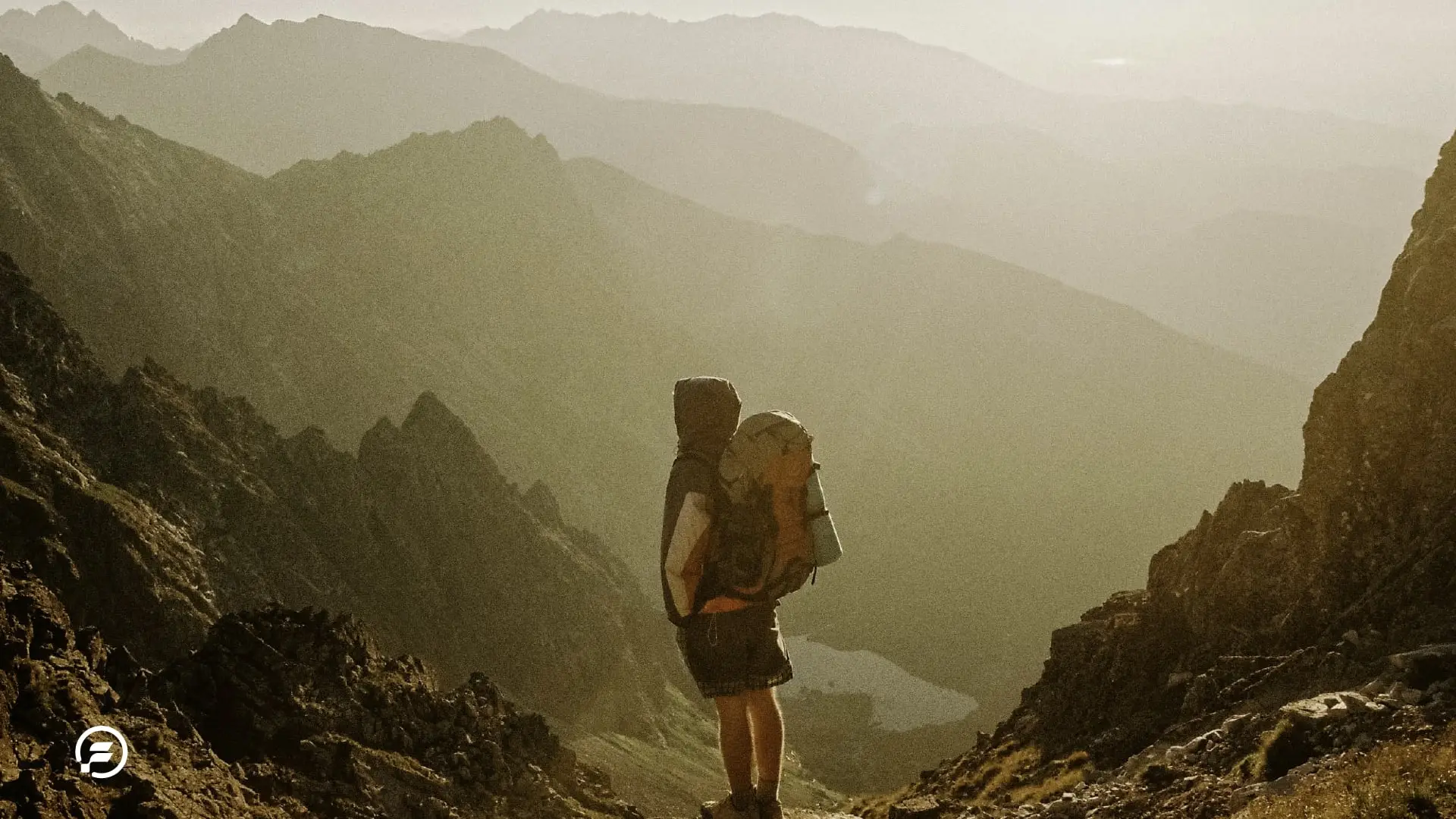 A backpacker making his way through the mountains.