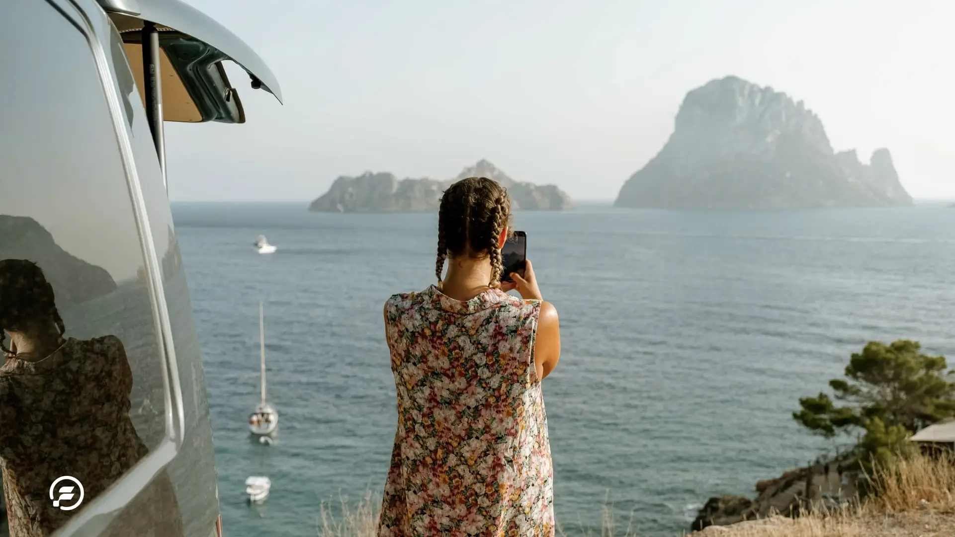 A digital nomad viewing the ocean and taking a picture