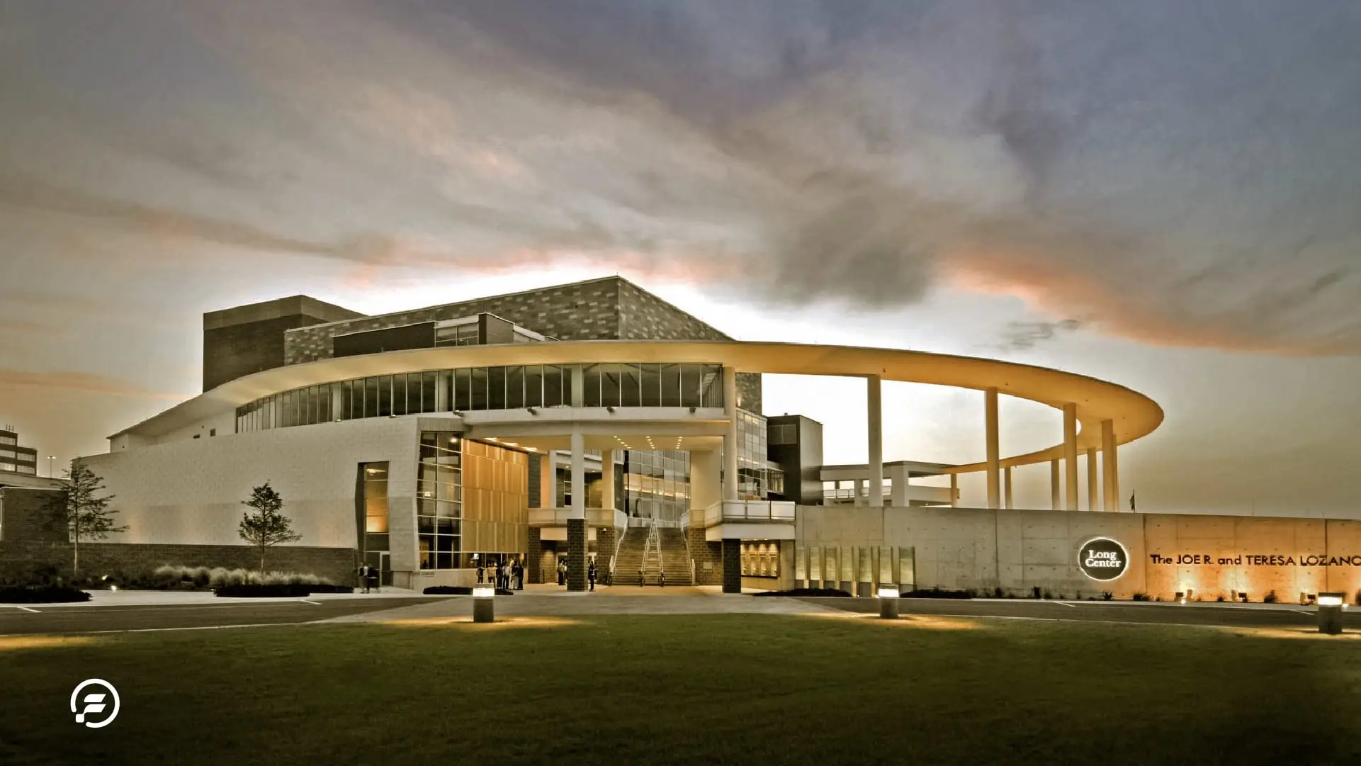 The Long Center in the evening time with a stormy cloud above it.