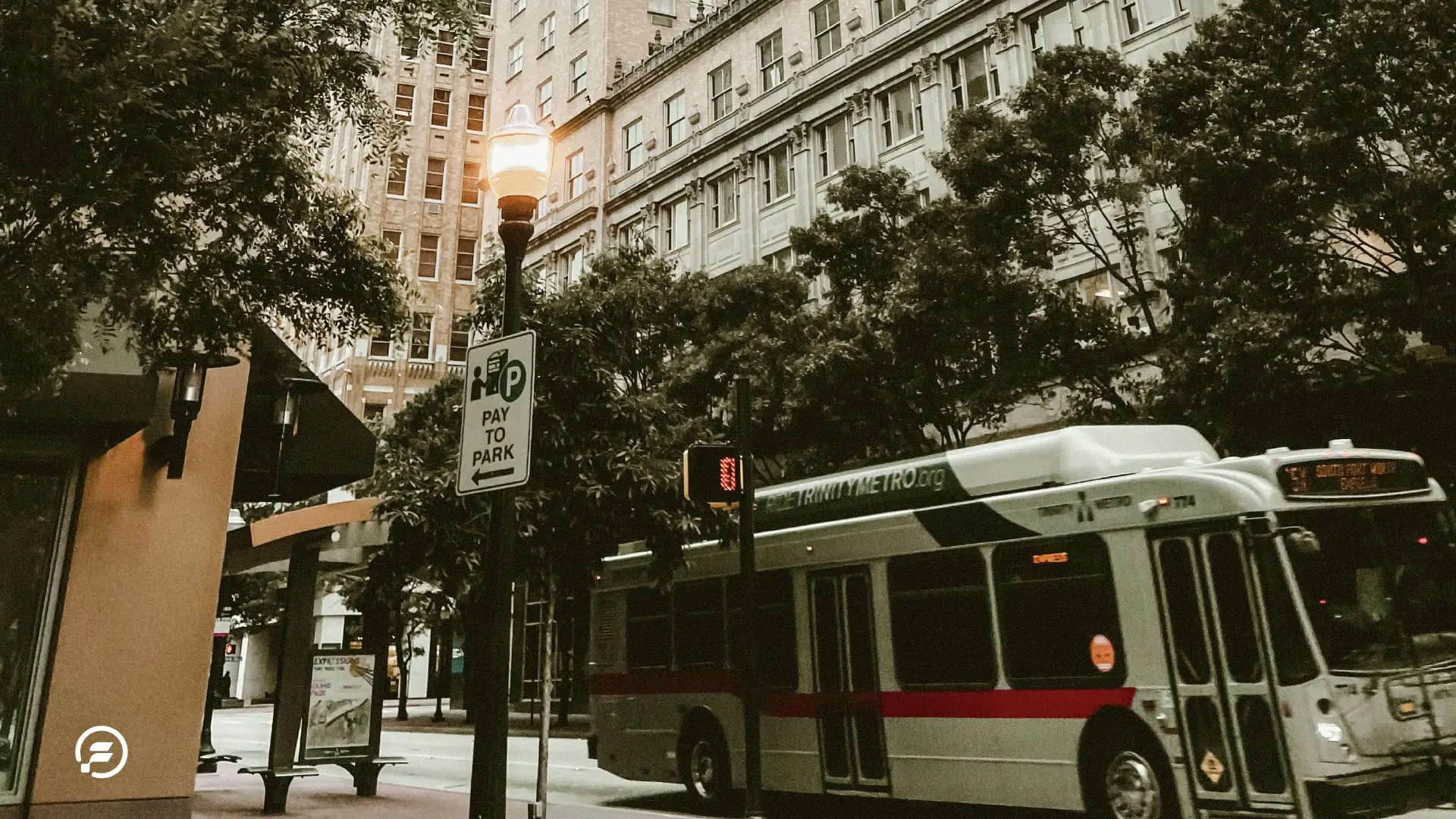 A city bus traveling through Austin Texas' city center.