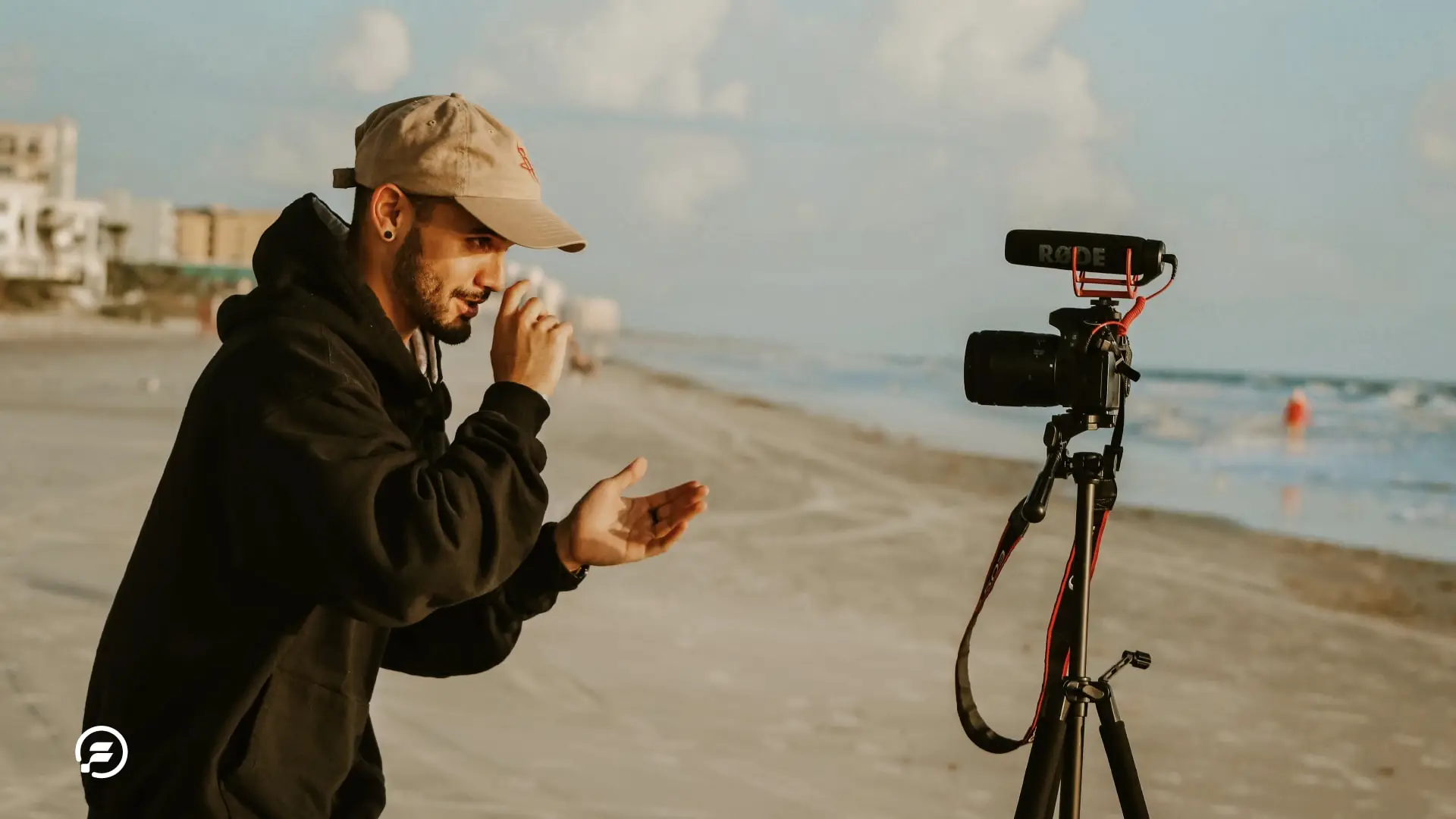 A influencer on the beach creating a new video for tik tok.