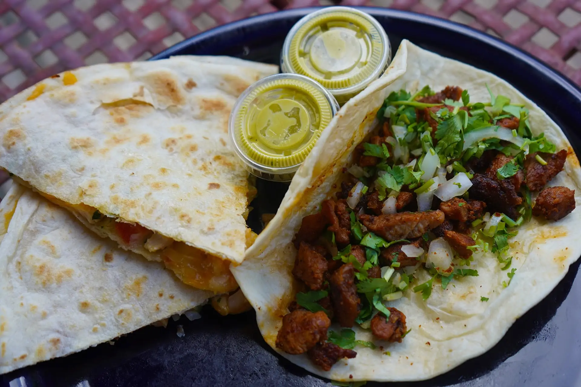 A delicious al pastor taco and quesadilla from Mami's Tacos food truck.