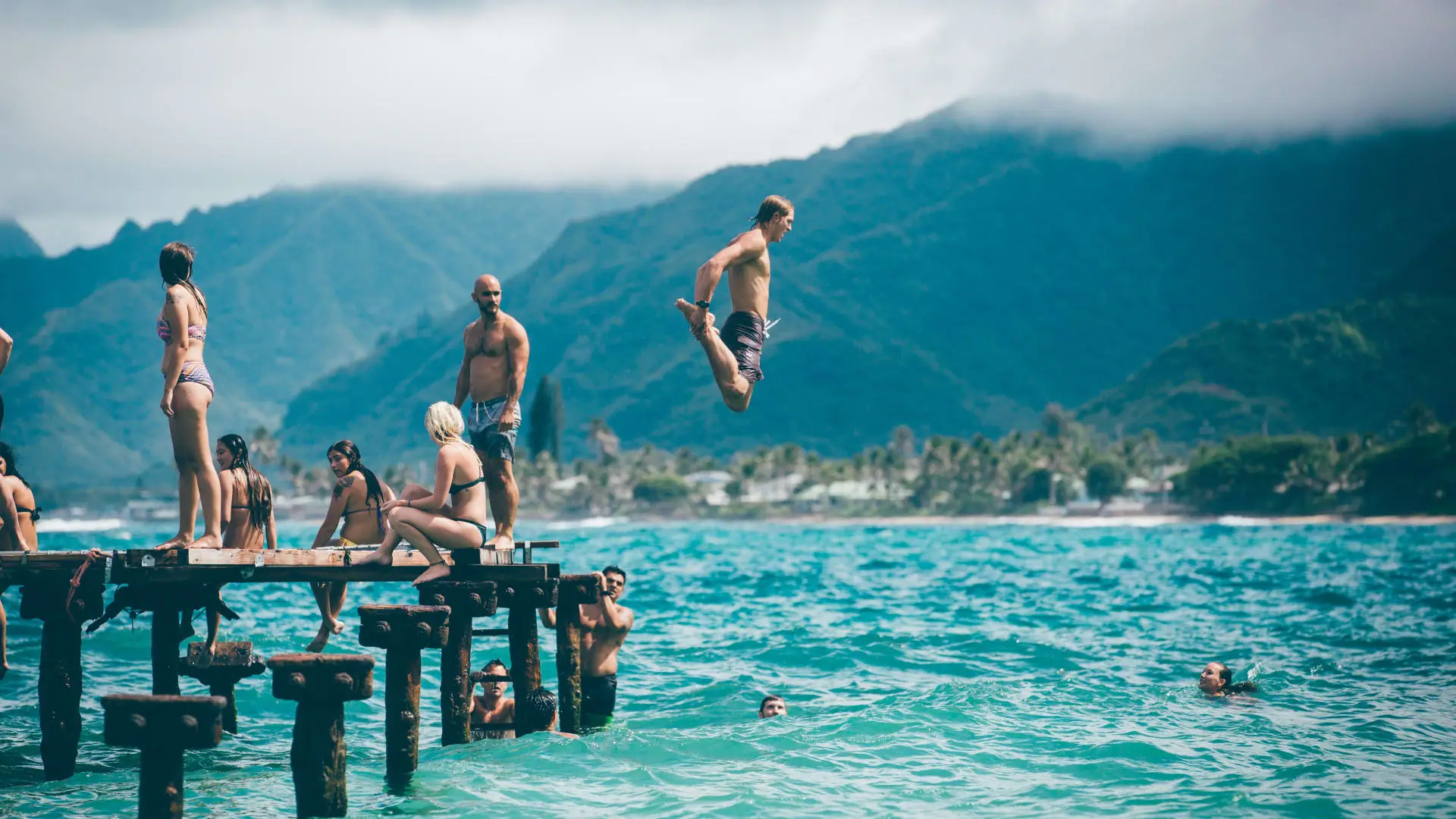 lake dock people diving in