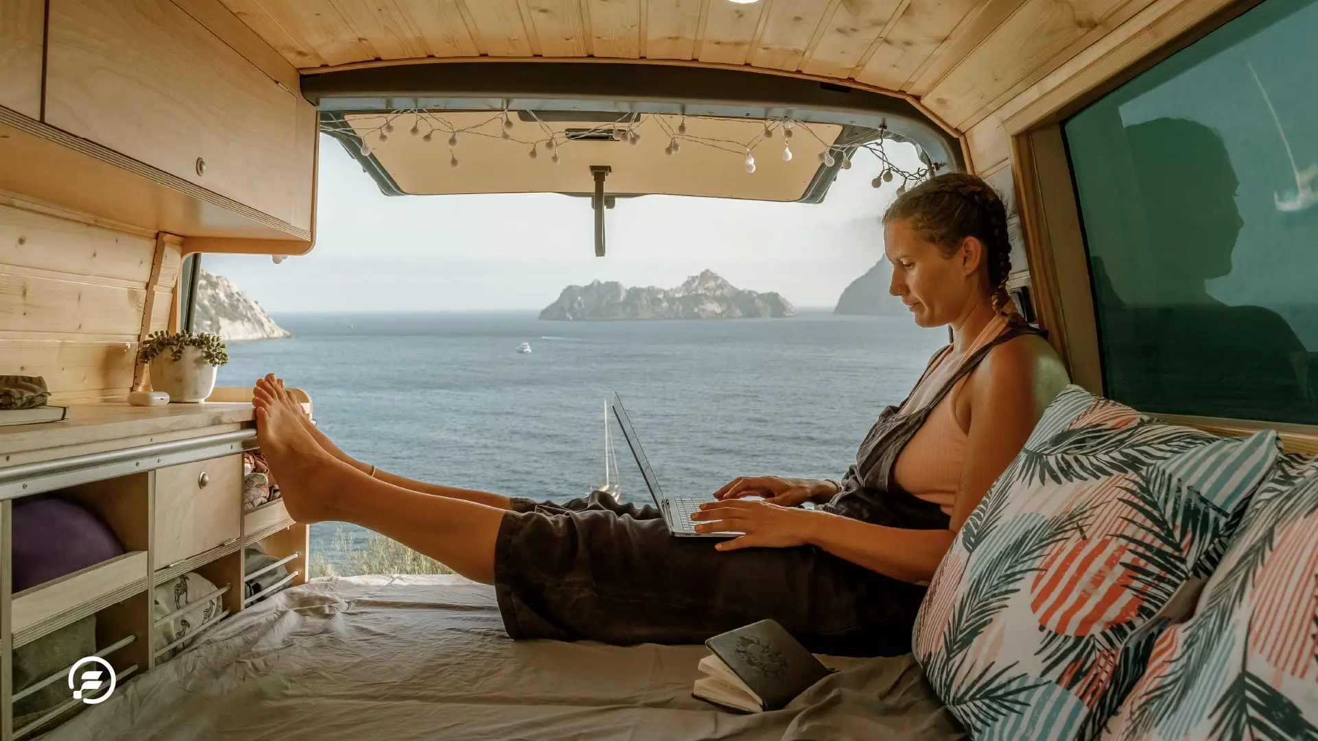 A digital nomad working from inside her van