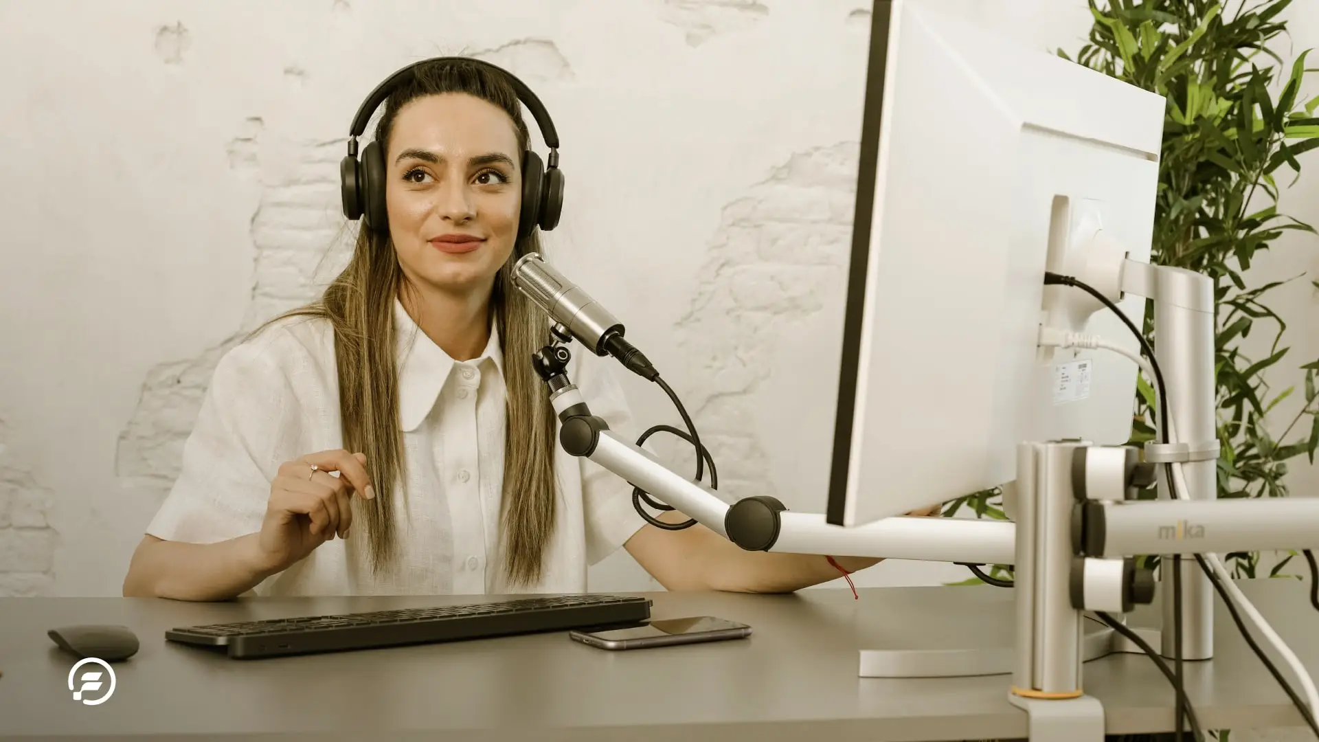 A content creator recording her podcast.
